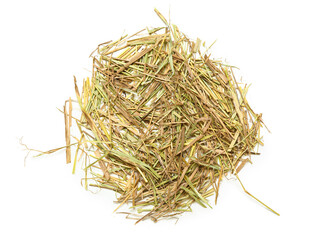 Straw scattered on white background