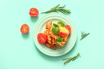 Plate of pasta with tomato sauce and cheese on turquoise background