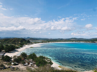 Fototapeta na wymiar Beautiful seascape with sandy beach and azure sea water in Lombok