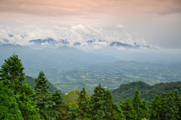 The white clouds on the top of the mountain rolled into the sky. Views of mountains and valleys in Miaoli County.
