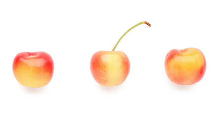 Sweet yellow cherries on white background