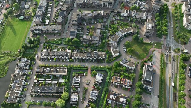 Modern Townhouse Residential Complex, With Solar Panels on Individual Unite Roofs, Newly Built in Amsterdam, Weesp, Netherlands - Aerial Top Down Flyover movement 