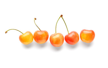 Sweet yellow cherries on white background