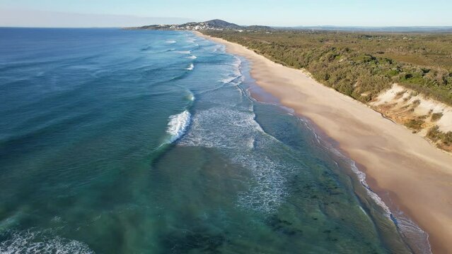 Aerial Above Sparkling Blue Waters And Golden Sands Of Coolum Beach In Queensland, Australia.