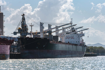 Fototapeta premium Bulk carrier boat docked at Gladstone port wharf, Queensland, Australia