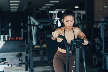 Fototapeta na wymiar Asian beautiful sport woman exercise on treadmill machine gym is sport healthy body building in fitness lifestyle