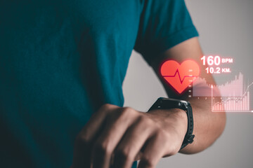 Man excercise and using smartwatch to monitoring and tracking health and heart rate by...