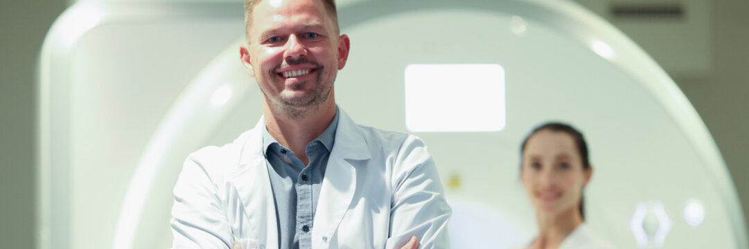 Happy Male Therapist Or Mri Specialist With Patient At Clinic