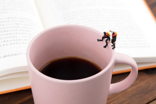 Mini scene diver on Coffee cup