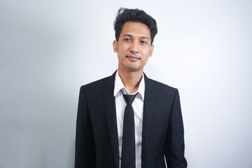 Portrait of handsome asian man in formal suit looking at camera smiling with toothy smile isolated in white background. Confident businessman ceo boss freelancer manager