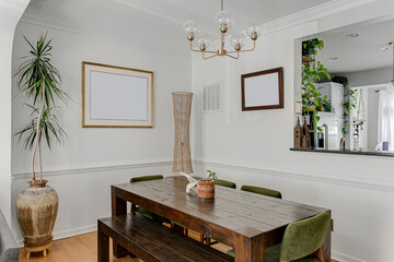 Bright Luxury organic sustainable mid century modern dining room with wood accents brass pendant light fixture and plants mockup