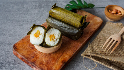 Lontong is indonesian traditional food, lontong or lontong isi. It made from rice filled with vegetables and wrapped inside a banana leaf and boiled