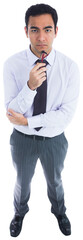 Digital png photo of sad asian businessman holding glasses on transparent background