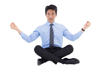 Digital png photo of focused asian businessman practising yoga on transparent background