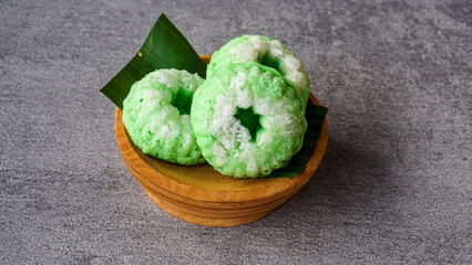 Indonesian traditional cake it called Putu ayu cake or kue putu ayu is sweety cake made from flour and palm sugar, it usually serve with grated coconut and founded at traditional market