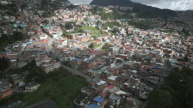 drone approaching over populated neighbourhood of Bogota Latin America Colombia capital dangerous city for crime and robbery 