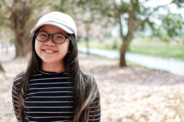 Cute Asian Thai Girl Smilling in Garden.