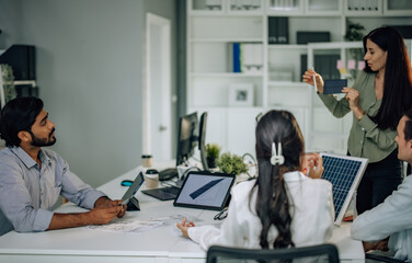 Obraz premium Startup team presents innovative, sustainable solar cell prototype. Reduce electricity costs, resource consumption, carbon footprint. Foster creative communication, eco-friendly decision-making.