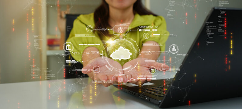 Woman uploading and transferring data from computer to cloud computing. Digital technology concept, data sheet management with large database capacity and high security.