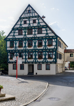 historic half-timbered house in Riedlingen with stork and stork's nest, in summer