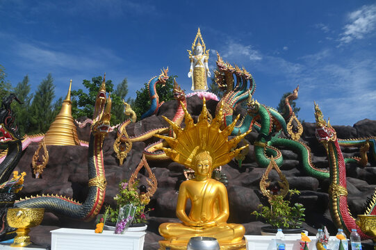 Group of beautiful statues of Buddha images, angels and Nagas at Wat Don Khanak Temple in order for religious people to travel to pay homage to the holy things. Located at Nakhon Pathom in Thailand.
