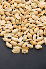 Whole shelled peanut nuts kernels close-up studio background