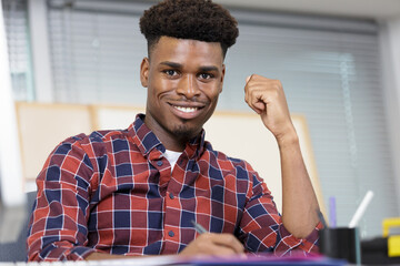 professional male office worker smiling and posing