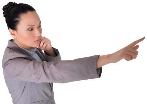 Digital png photo of serious asian businesswoman pointing with finger on transparent background