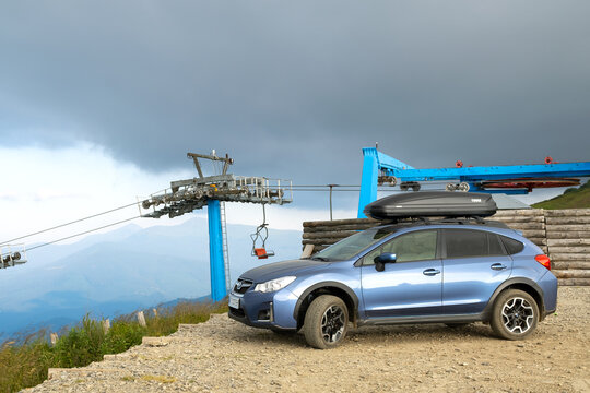 Blue Subaru Crosstrek off road car on mountain trail. Traveling by auto, adventure in wildlife, expedition or extreme travel on SUV automobile. Karpaty, Ukraine - July 7, 2021.