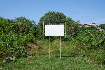 selevtive focus on Realistic white traffic sign on two metal poles. Rectangular blank traffic road empty sign. Mock up template for your design.