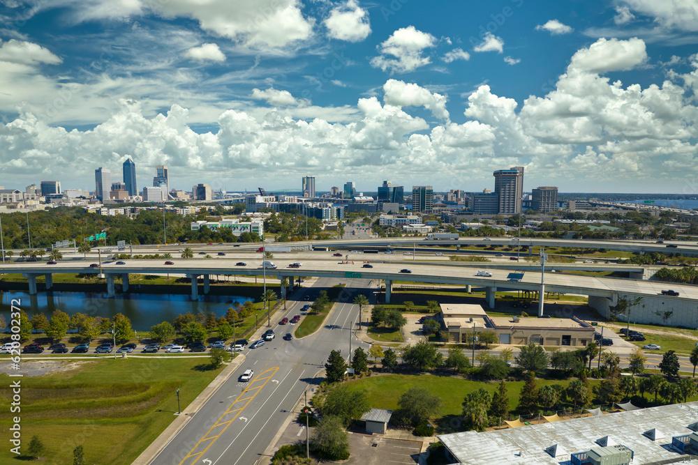 Wall mural aerial view of jacksonville city with high office buildings and american freeway intersection with f