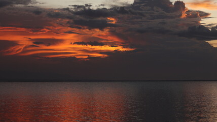 Beautiful sunset over the sea with reflection in water