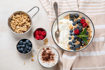 Healthy breakfast, cereal with berries and yogurt.