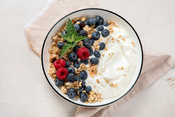 Healthy breakfast, cereal with berries and yogurt.