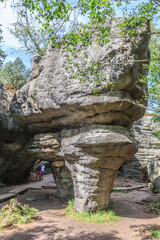 Tourist trail in Errant Rocks (Błędne Skały) through a picturesque labyrinth (rock city) in the Central Sudetes in the Stolowe Mountains (Poland) © IwoiWo