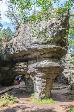 Tourist trail in Errant Rocks (Błędne Skały) through a picturesque labyrinth (rock city) in the Central Sudetes in the Stolowe Mountains (Poland)