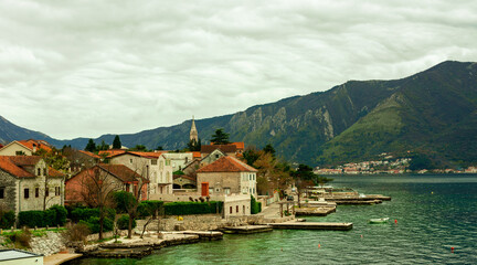 Fototapeta na wymiar Landscape of the coast of the Bay of Kotor with old roman buildings, Dobrota Montenegro