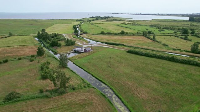 Flying over bridge and a river in Polish nature reserve "Beka".