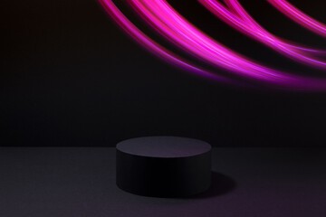 Black abstract stage with one circle podium mockup with energy curved pink lines of glowing rays,...