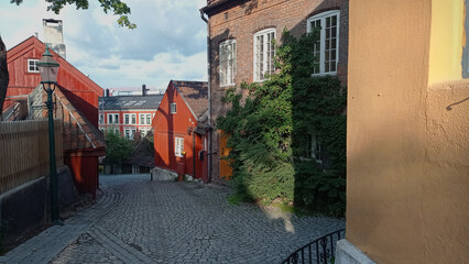 Historical Damstredet street in Oslo, Norway. Damstredet is a cobbled street with wooden houses from the first half of the 19th century.