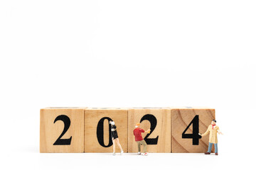 Miniature People Graffiti Artist spraying Number 2024 On Wooden Block