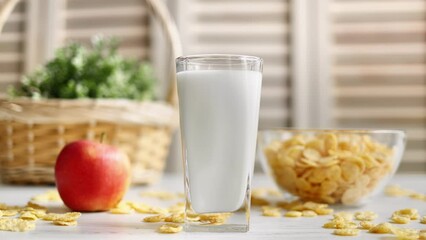 Healthy summer fitness diet breakfast corn flakes glass of milk apple serving kitchen rustic table - Powered by Adobe