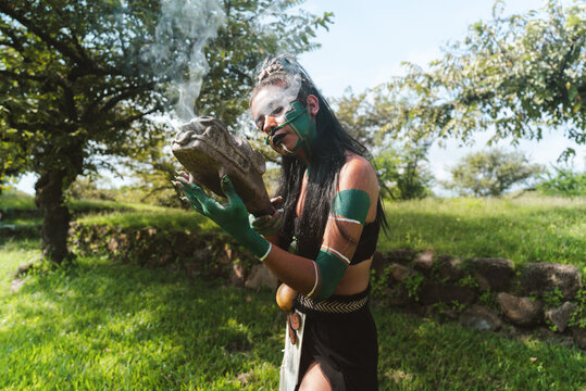 Mayan female warrior carrying fire stone