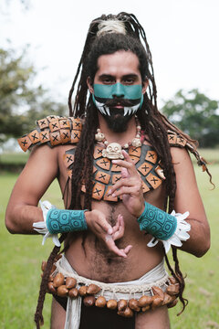 Indigenous man doing hand signs