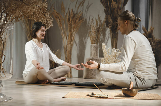 Couple meditating in lotus pose together