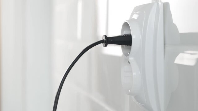 Unplug Electrical Cord in Wall European Socket, Unplugging in Equipment, Electric Power View, Save Cost in Energy Industry Crisis