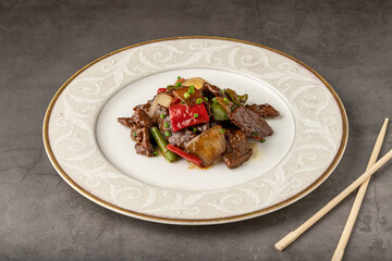 Hot and sour meat sauteed with red pepper, green pepper and onion. Asian cuisine