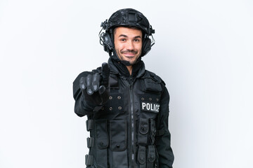 Young caucasian SWAT man isolated on white background showing and lifting a finger