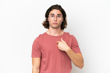 Young handsome man isolated on white background pointing to oneself