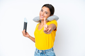 Woman with Inflatable Travel Pillow over isolated background showing and lifting a finger